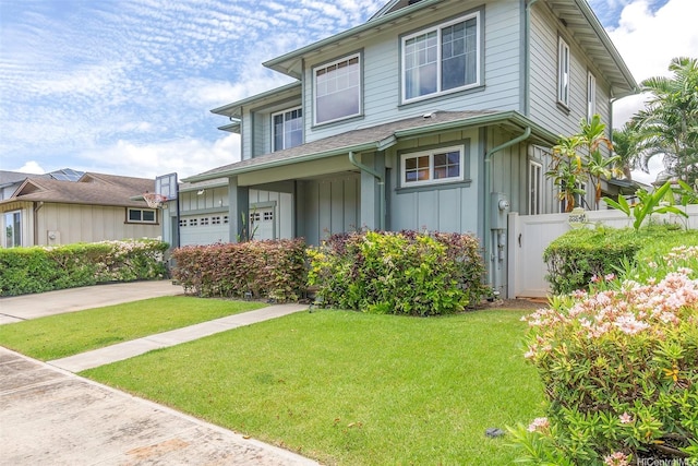 91-1152 Paapaana St, Ewa Beach, HI 96706 - view of front of home featuring board and batten siding, driveway, and a garage