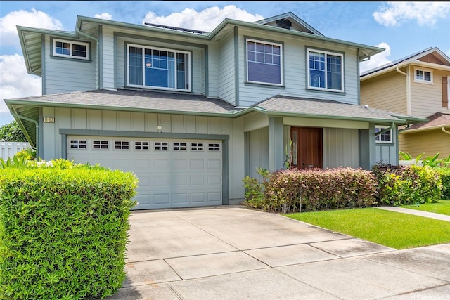 91-1152 Paapaana St, Ewa Beach, HI 96706 - view of front facade featuring board and batten siding, a garage, driveway, and roof with shingles