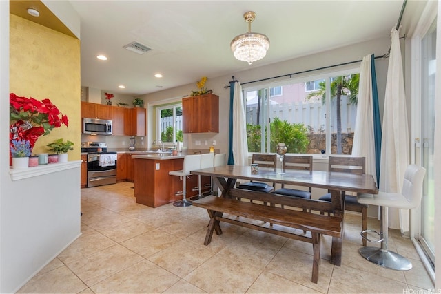 91-1152 Paapaana St, Ewa Beach, HI 96706 - dining room featuring recessed lighting, light tile patterned floors, and a chandelier