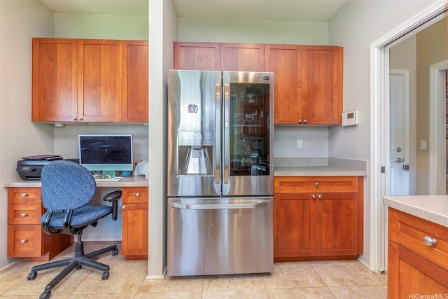 91-1152 Paapaana St, Ewa Beach, HI 96706 - kitchen featuring stainless steel fridge with ice dispenser, light countertops, a desk, and brown cabinets