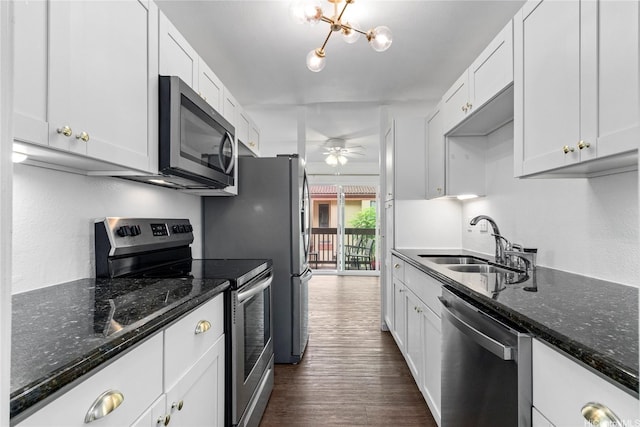 46-078 Emepela Pl Unit G205, Kaneohe, HI 96744 - kitchen with appliances with stainless steel finishes, a sink, white cabinetry, ceiling fan, and dark wood-style flooring