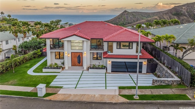 123 Waihili Pl, Honolulu, HI 96825 - mediterranean / spanish house with a balcony, stucco siding, a tile roof, and a mountain view