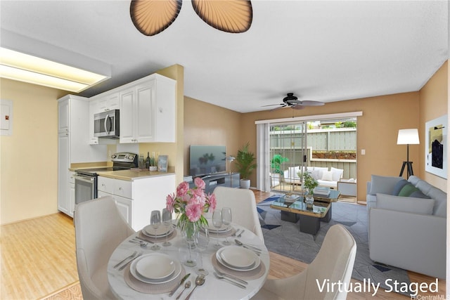 94-1336 Kulewa Loop Unit 5D, Waipahu, HI 96797 - dining area featuring light wood-style flooring and ceiling fan