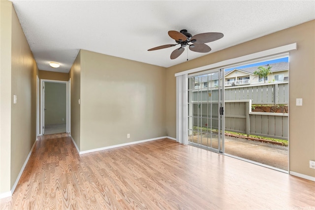 94-1336 Kulewa Loop Unit 5D, Waipahu, HI 96797 - unfurnished room with wood finished floors, a ceiling fan, and baseboards