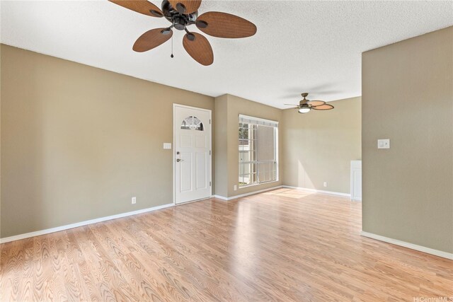 94-1336 Kulewa Loop Unit 5D, Waipahu, HI 96797 - empty room with a ceiling fan, light wood-style floors, and baseboards