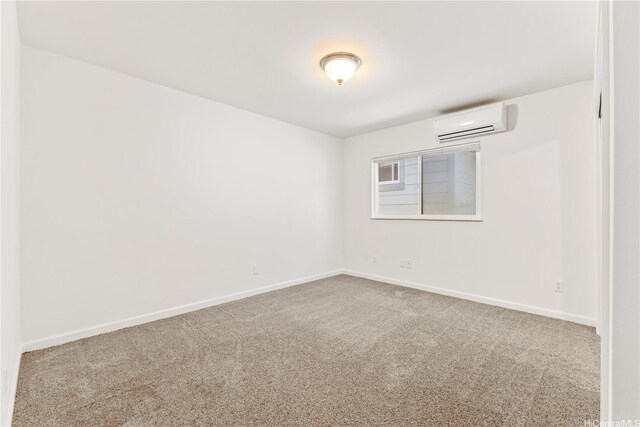 1410 Alapai St Unit 5, Honolulu, HI 96813 - carpeted empty room with an AC wall unit and baseboards