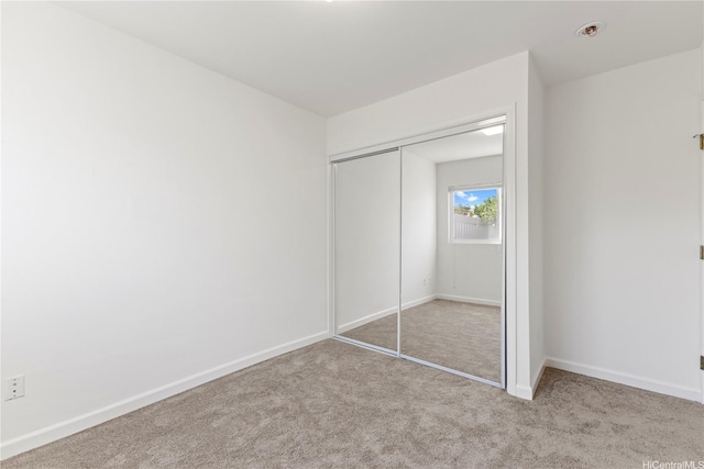 1410 Alapai St Unit 5, Honolulu, HI 96813 - unfurnished bedroom featuring a closet, carpet flooring, and baseboards