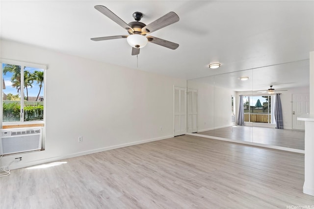 91-225 Hanapouli Cir Unit 33F, Ewa Beach, HI 96706 - unfurnished living room with ceiling fan, wood finished floors, and a wall mounted AC