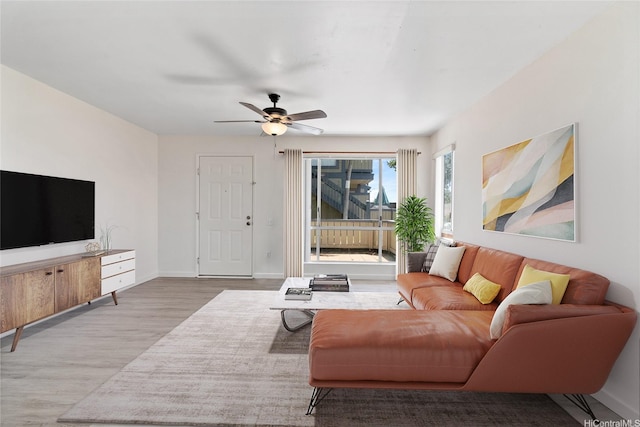 91-225 Hanapouli Cir Unit 33F, Ewa Beach, HI 96706 - living area with wood finished floors and a ceiling fan