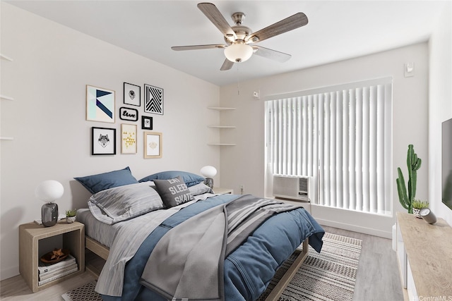 91-225 Hanapouli Cir Unit 33F, Ewa Beach, HI 96706 - bedroom featuring light wood-style floors, cooling unit, and a ceiling fan