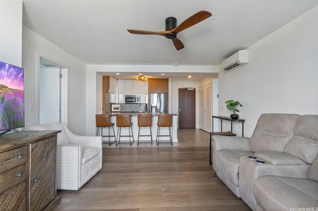 600 Ala Moana Blvd Unit 3006, Honolulu, HI 96813 - living room featuring a wall unit AC, ceiling fan, light wood-type flooring, and recessed lighting