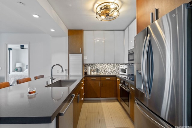 600 Ala Moana Blvd Unit 3006, Honolulu, HI 96813 - kitchen with stainless steel appliances, a sink, dark countertops, tasteful backsplash, and recessed lighting