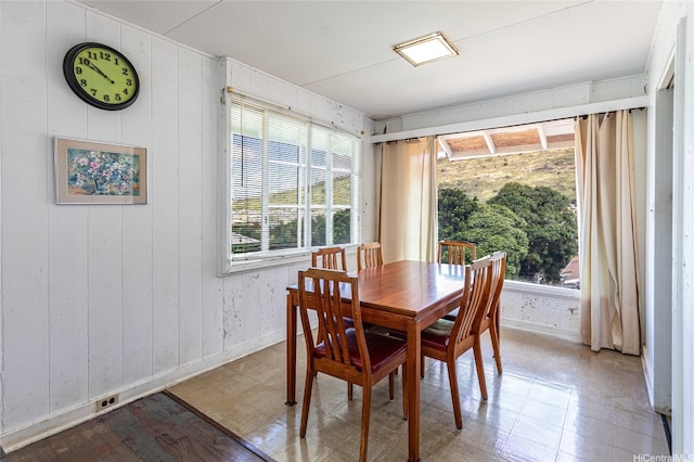 1968 10th Ave, Honolulu, HI 96816 - dining area with plenty of natural light, baseboards, and wood walls