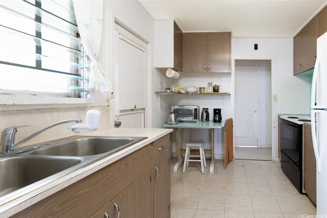 1968 10th Ave, Honolulu, HI 96816 - kitchen with black electric range, a sink, light countertops, open shelves, and freestanding refrigerator
