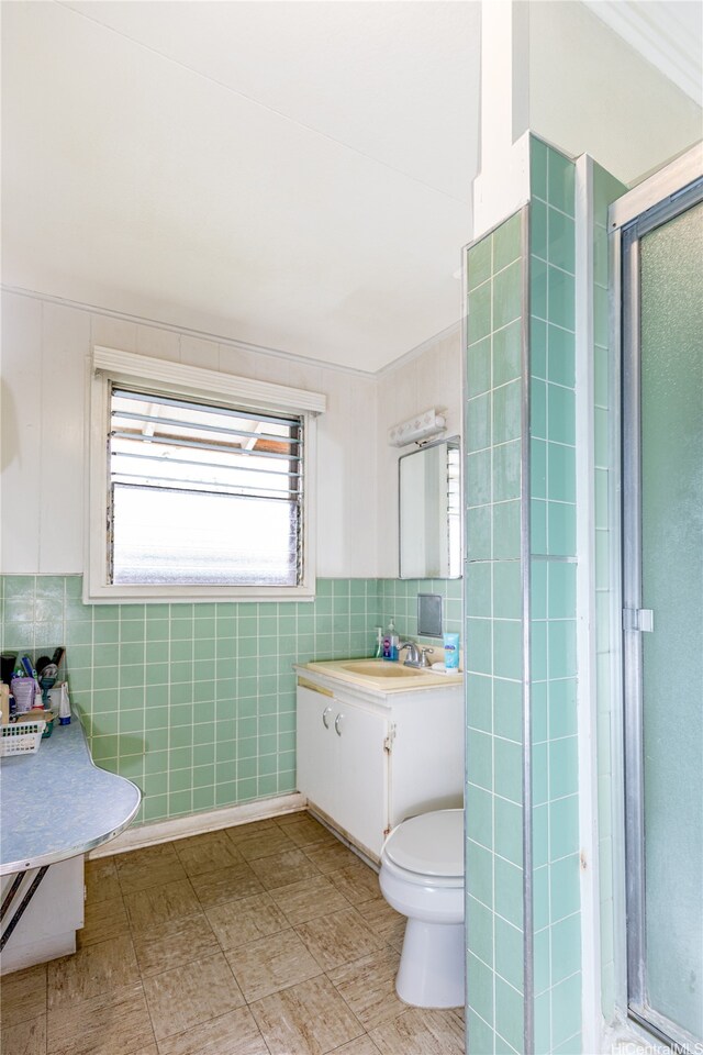 1968 10th Ave, Honolulu, HI 96816 - bathroom featuring vanity, a shower stall, toilet, and tile walls