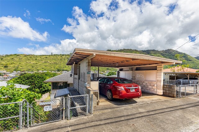 1968 10th Ave, Honolulu, HI 96816 - view of car parking with a gate, a carport, and a mountain view
