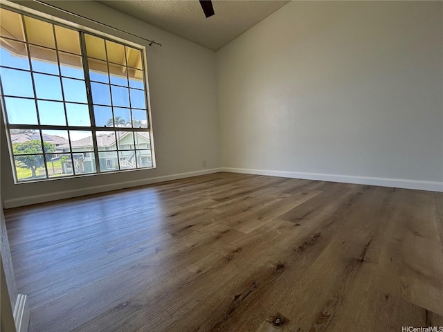 941449 Waipio Uka St Unit K204, Waipahu, HI 96797 - unfurnished room featuring baseboards, wood finished floors, and a ceiling fan
