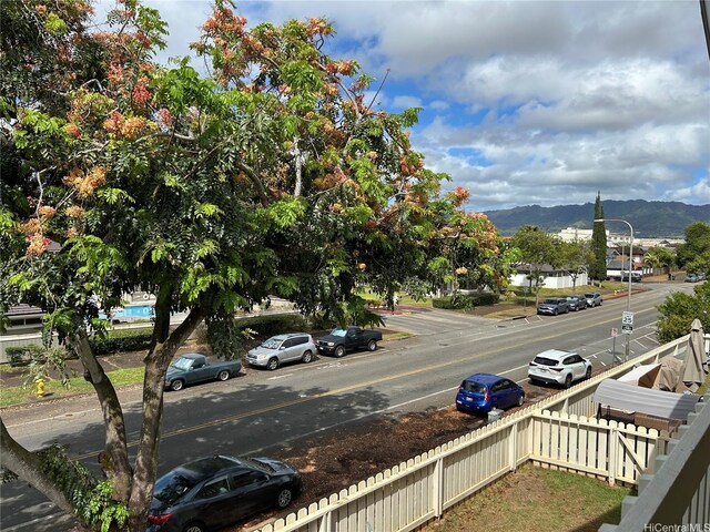 941449 Waipio Uka St Unit K204, Waipahu, HI 96797 - view of asphalt street featuring street lights, a mountain view, sidewalks, and curbs