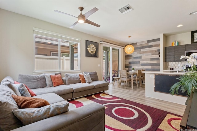 91-1159 Kamakana St Unit 818, Ewa Beach, HI 96706 - living room featuring light wood finished floors, a ceiling fan, and recessed lighting