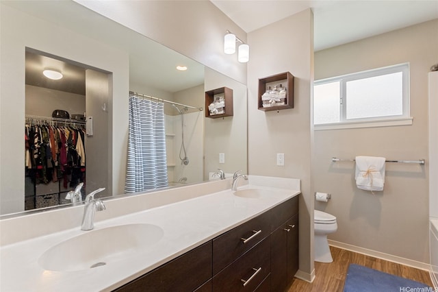 91-1159 Kamakana St Unit 818, Ewa Beach, HI 96706 - full bathroom featuring a shower with shower curtain, double vanity, wood finished floors, a bathtub, and a spacious closet
