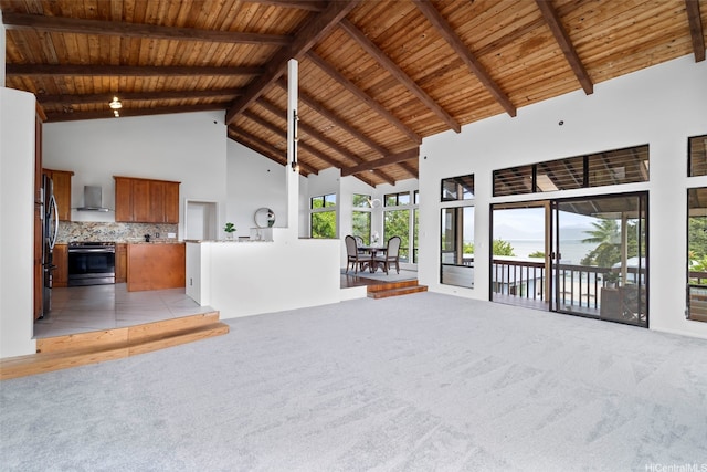 44-279 Kaneohe Bay Dr Unit B, Kaneohe, HI 96744 - unfurnished living room featuring wood ceiling with exposed beams, high vaulted ceiling, and light colored carpet