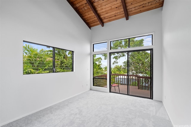 44-279 Kaneohe Bay Dr Unit B, Kaneohe, HI 96744 - empty room featuring wood ceiling with exposed beams, carpet floors, high vaulted ceiling, and baseboards