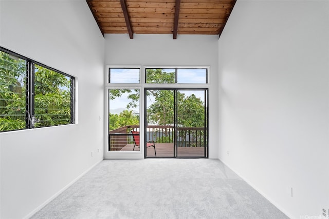44-279 Kaneohe Bay Dr Unit B, Kaneohe, HI 96744 - carpeted empty room with wooden ceiling with exposed beams, a high ceiling, and baseboards