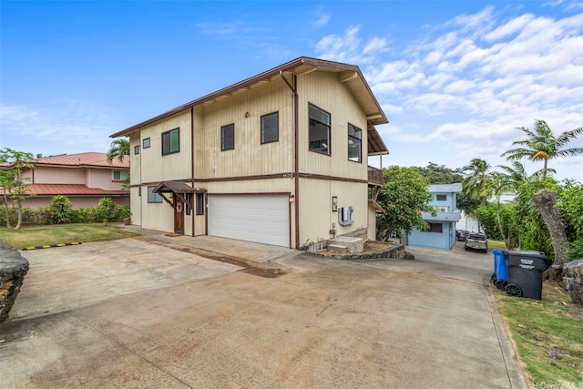 44-279 Kaneohe Bay Dr Unit B, Kaneohe, HI 96744 - back of house with driveway and a garage