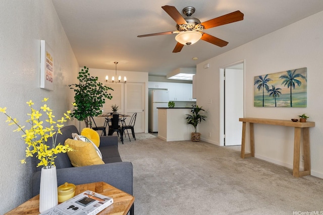 492 Mananai Pl Unit 13E, Honolulu, HI 96818 - living area featuring a chandelier, ceiling fan, light carpet, and baseboards