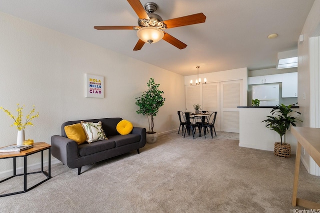 492 Mananai Pl Unit 13E, Honolulu, HI 96818 - living area featuring a chandelier, carpet, and ceiling fan