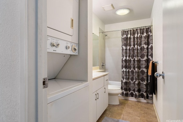 492 Mananai Pl Unit 13E, Honolulu, HI 96818 - bathroom with estacked washer and dryer, toilet, vanity, and shower / bath combination with curtain
