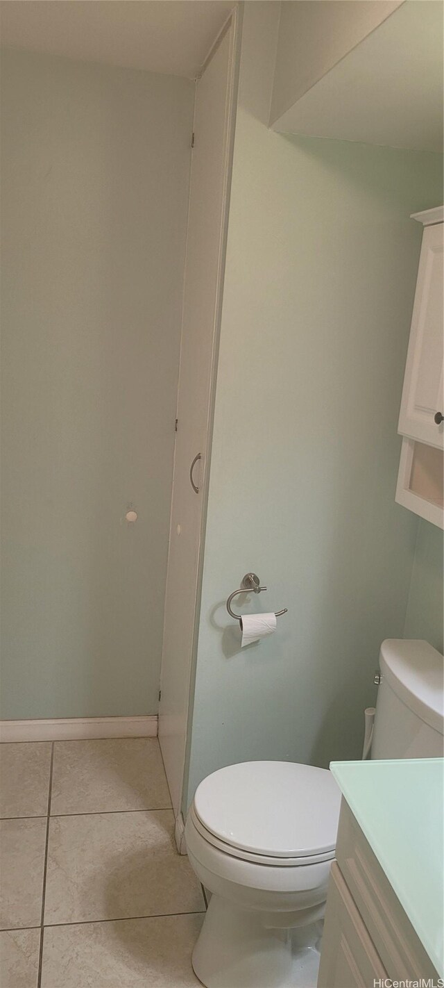 1402 Piikoi St Unit 502, Honolulu, HI 96822 - bathroom with toilet, tile patterned floors, vanity, and baseboards