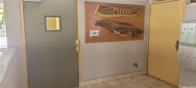 1402 Piikoi St Unit 502, Honolulu, HI 96822 - entryway with light tile patterned floors and mail area