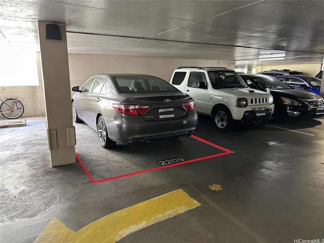 2345 Ala Wai Blvd Unit 2209, Honolulu, HI 96815 - parking garage featuring concrete block wall