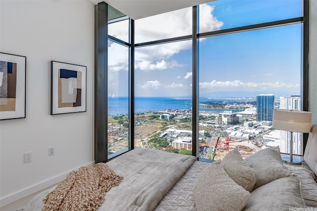 1100 Ala Moana Blvd Unit 4000/4001, Honolulu, HI 96814 - bedroom featuring a wall of windows, multiple windows, baseboards, and a view of city