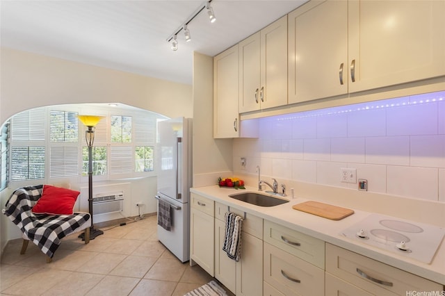 1020 Green St Unit 303, Honolulu, HI 96822 - kitchen with white appliances, backsplash, light countertops, light tile patterned flooring, and a wall mounted AC