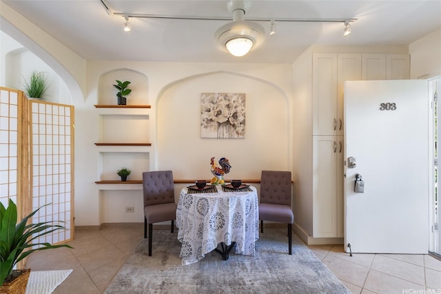 1020 Green St Unit 303, Honolulu, HI 96822 - dining area featuring track lighting, light tile patterned floors, and built in features