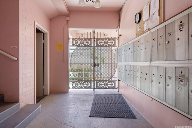 1020 Green St Unit 303, Honolulu, HI 96822 - doorway to outside featuring mail area and lofted ceiling