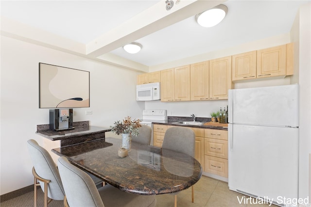 229 Paoakalani Ave Unit 1501, Honolulu, HI 96815 - kitchen with white appliances, light brown cabinets, a kitchen bar, and beam ceiling