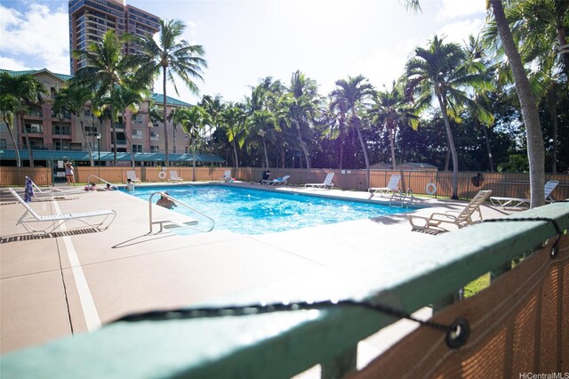 3009 Ala Makahala Pl Unit 1815, Honolulu, HI 96818 - community pool featuring a patio area and a shed