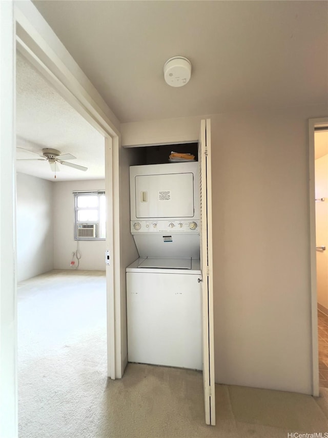 3009 Ala Makahala Pl Unit 1815, Honolulu, HI 96818 - washroom featuring stacked washer and clothes dryer, carpet floors, ceiling fan, and cooling unit