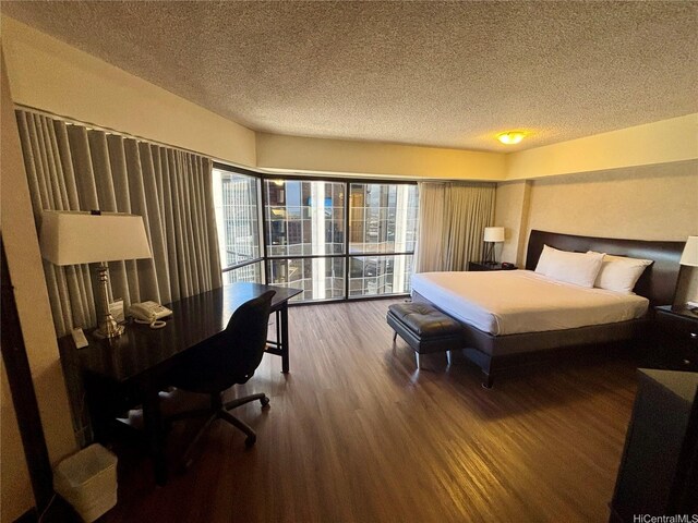 1088 Bishop Sts Unit 3109, Honolulu, HI 96813 - bedroom with wood finished floors and a textured ceiling