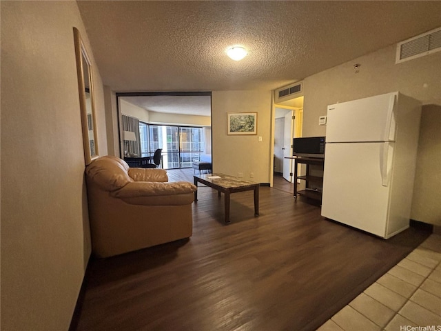 1088 Bishop Sts Unit 3109, Honolulu, HI 96813 - living room with a textured ceiling and wood finished floors