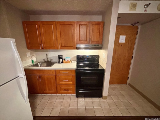 1088 Bishop Sts Unit 3109, Honolulu, HI 96813 - kitchen featuring black / electric stove, under cabinet range hood, freestanding refrigerator, a sink, and brown cabinets