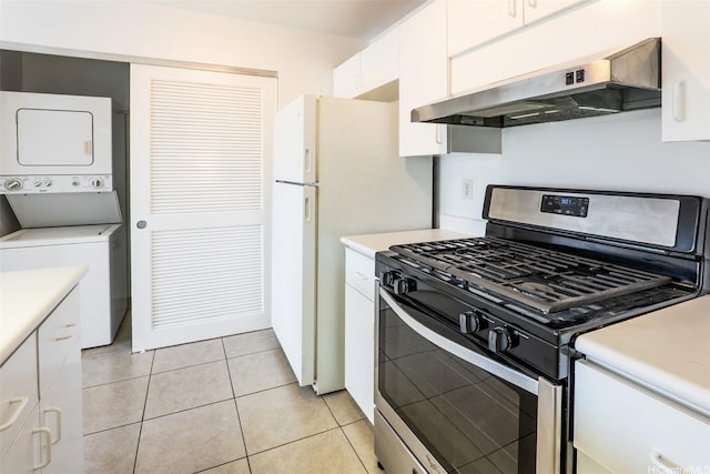 91-1199 Mikohu St Unit 39D, Ewa Beach, HI 96706 - kitchen with gas stove, ventilation hood, stacked washing machine and dryer, white cabinets, and light countertops