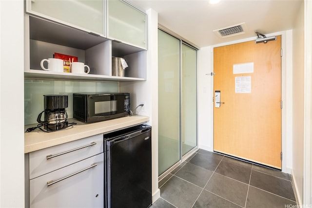 410 Atkinson Dr Unit 2418, Honolulu, HI 96814 - kitchen featuring black microwave, dark tile patterned floors, light countertops, open shelves, and dishwasher