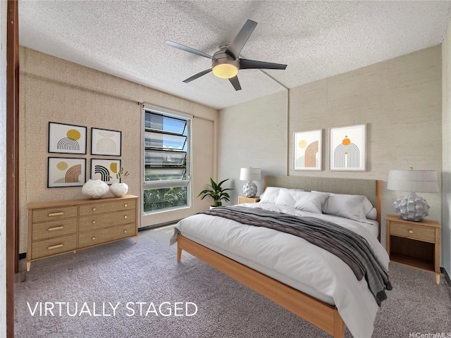 955 Ala Lilikoi St Unit 305, Honolulu, HI 96818 - bedroom with a textured ceiling, carpet, and a ceiling fan