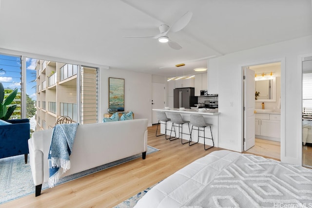 53-549 Kamehameha Hwy Unit 402, Hauula, HI 96717 - living area featuring light wood-type flooring and a ceiling fan