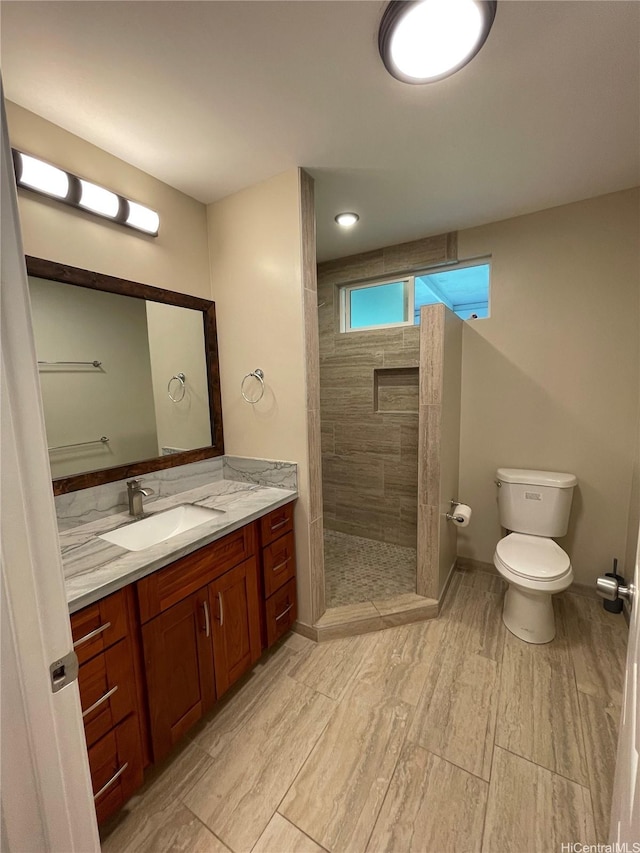 53-388 Kamehameha Hwy, Hauula, HI 96717 - bathroom with toilet, vanity, a tile shower, and wood finished floors