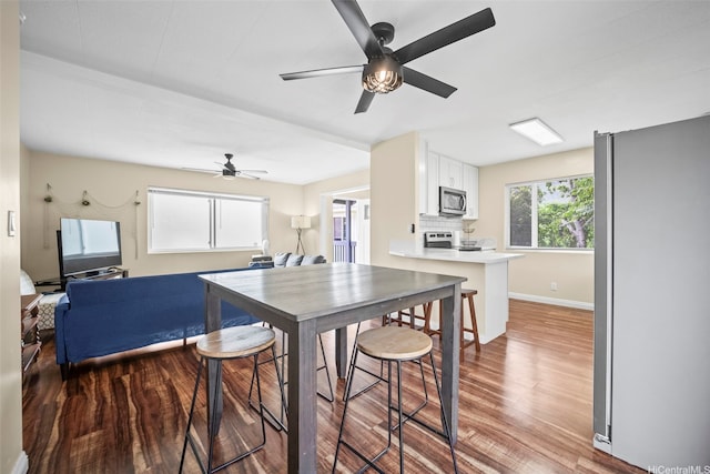 53-388 Kamehameha Hwy, Hauula, HI 96717 - dining space with ceiling fan, wood finished floors, and baseboards